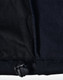 A close-up of a black ladies softshell jacket, highlighting the inner lining and adjustable hem detail.