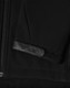 A black softshell jacket featuring a zippered front and a textured patch on the sleeve. It has a logo.