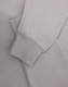 A light grey polar fleece jumper featuring a half zip collar and fitted cuffs. It has a subtle logo.