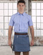A denim half apron with a brown waistband, worn by a person in a blue checked shirt, against a city skyline backdrop.