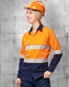 A high-visibility long sleeve safety shirt in orange and navy, featuring segmented reflective tape, with a hard hat.