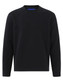 A black crewneck fleece sweatshirt featuring long sleeves and a ribbed hem. It includes a logo on the interior.