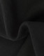 A close-up of soft, black fabric showcasing a textured surface, indicating a fleece material.
