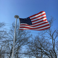 Nylon American Flag flying high and proud. All 100% Made in the U.S.A.