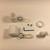 White Never Furl Flag Attachment Kit Includes: 2-Never Furl Bushings, 2-Shaft Collars, 2 Stainless Steel Rings, 2 Flag Clips, 2-Self Tapping Screws, 1 Allen Wrench