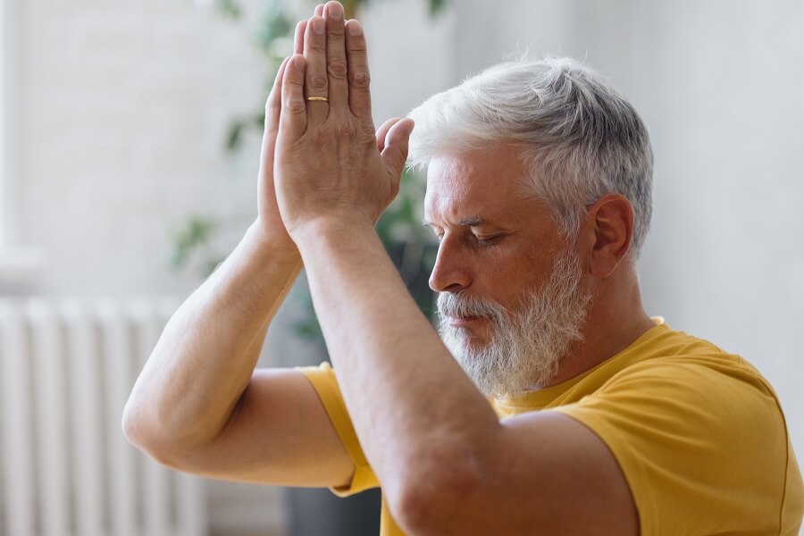 Man Practicing Mindfulness and Deep Breathing