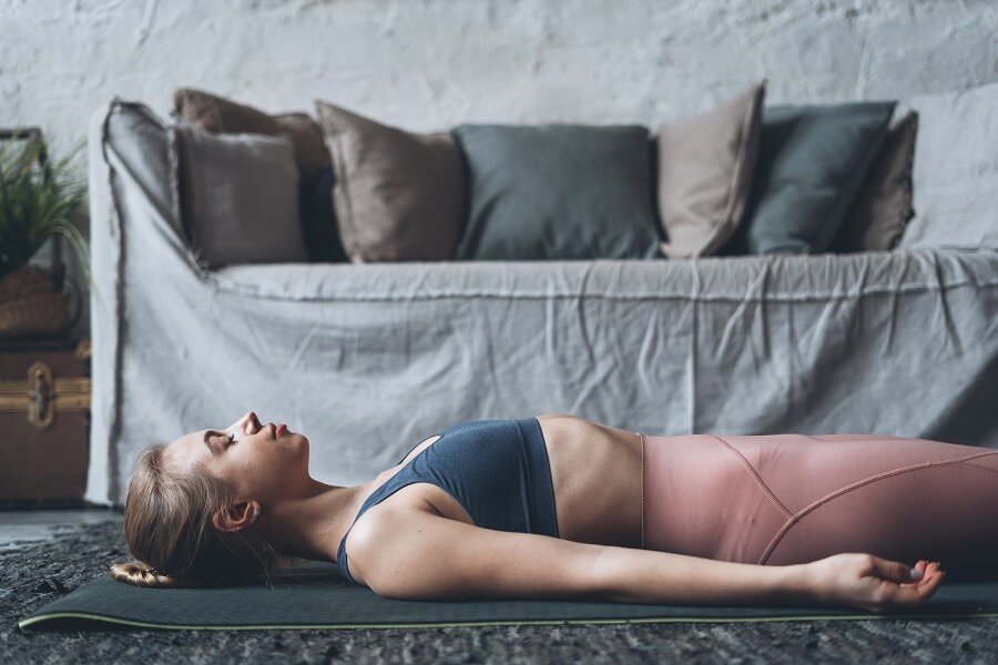 Woman Relaxing in a Yoga Pose