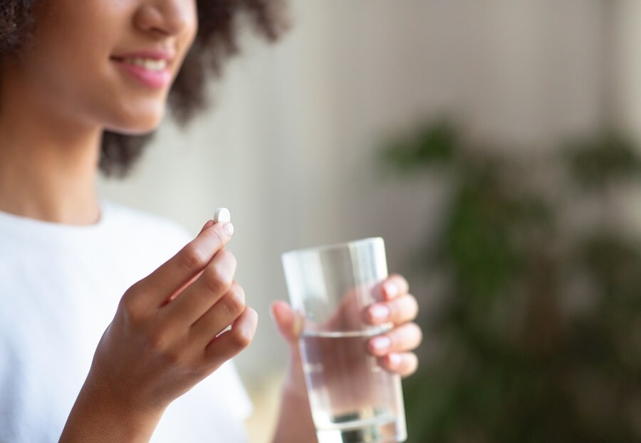 Woman Taking Vitamins