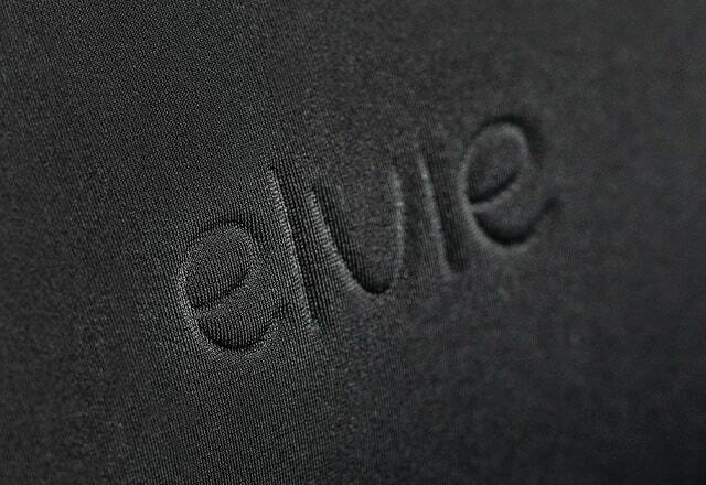 A close up of the embossed Elvie logo on the bag. The work Elvie is pressed into the fabric of the bag