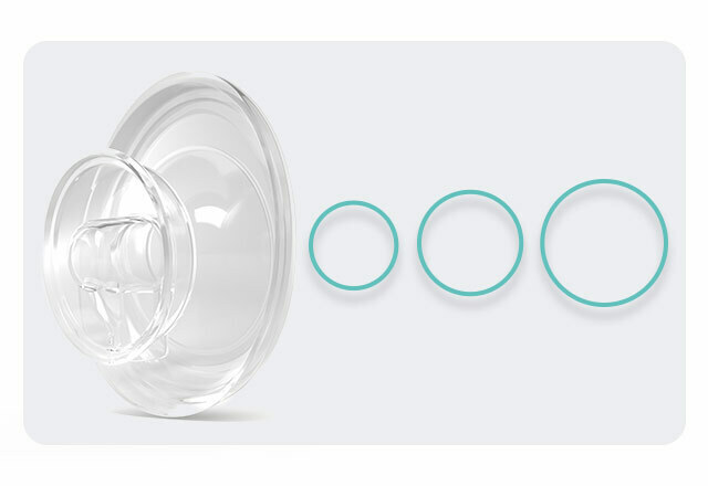 The plastic shield part of an Elvie Stride shown next to three rings increasing in size, to demonstrate the different sizes available