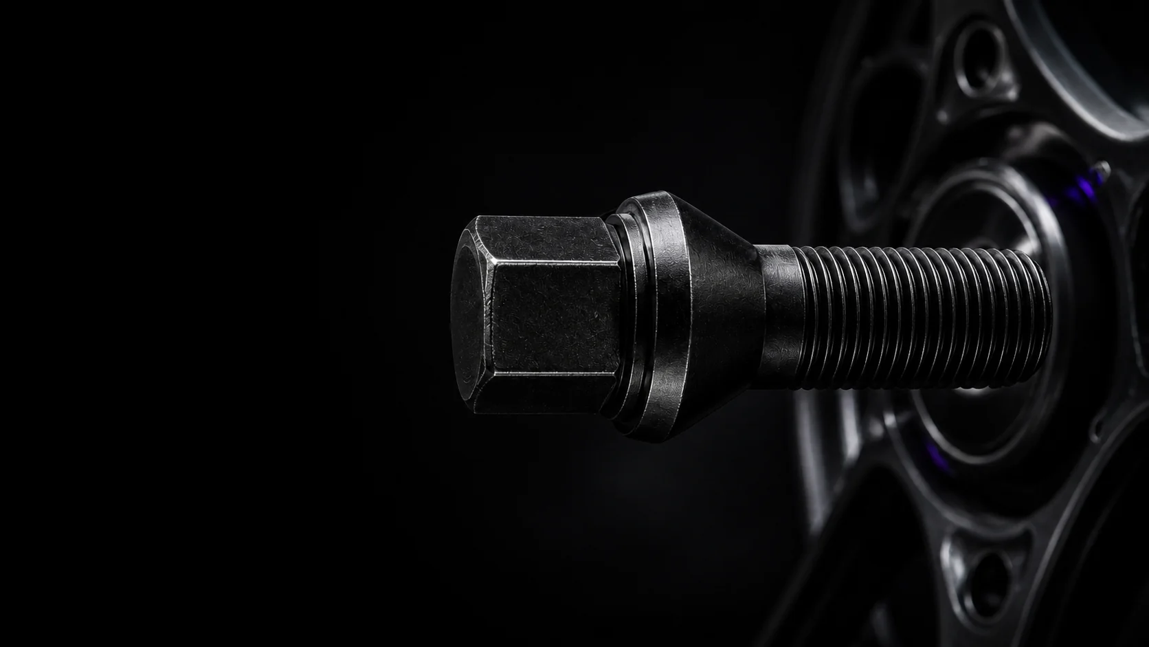 H and R wheel bolt beside a graphite wheel