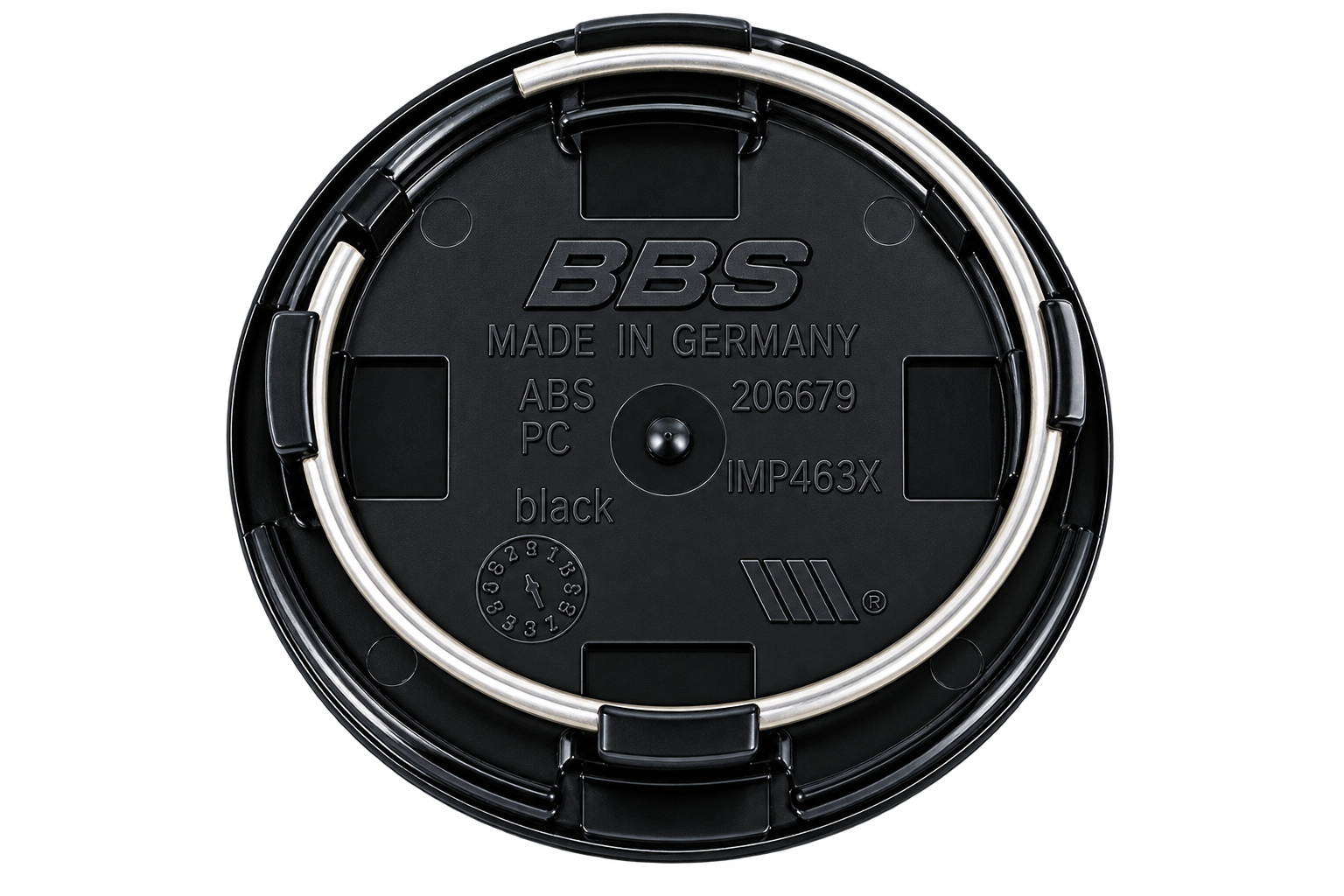 Backside of a BBS Type C center cap showing four tabs and a spring ring
