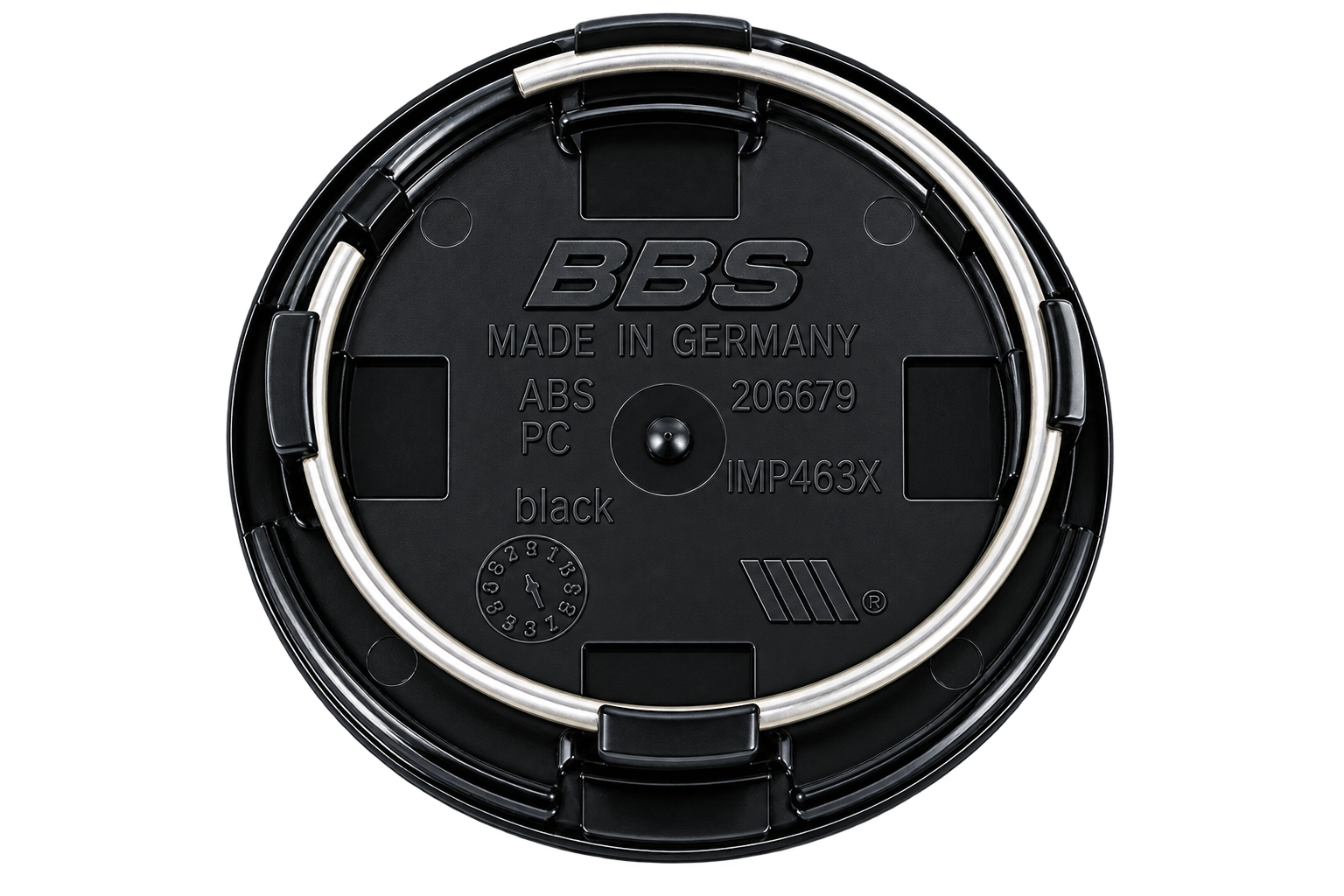 Backside of a BBS Type C center cap showing four tabs and a spring ring