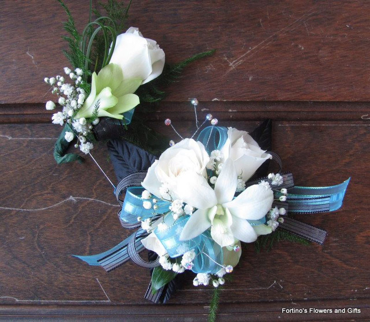 Corsage and matching boutonniere Fortino's Flowers and Gifts