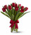 Red tulips vased.