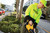 CornerStone® Enhanced Visibility Fleece Pullover Hoodie – high-visibility moisture-wicking work hoodie with black bottom, three-panel hood, and front pouch pocket.