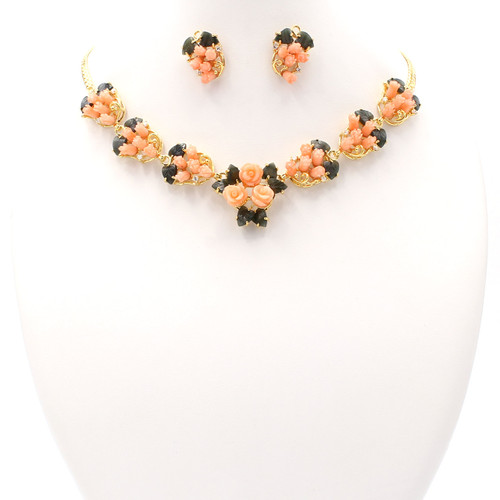 Matching necklace and earrings set of coral, jade, and real gold