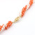 Pink coral branch and pearl necklace with golden fishhook clasp