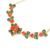 Natural red coral, jade leaf stones along a gold plated necklace chain