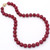 Red jade and 22k gold necklace at Abson Inc