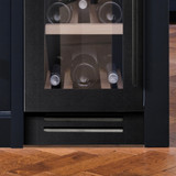 Caple wine cooler cabinet with glass bottles displayed on racks. Caple Class 3 Grill installed for s