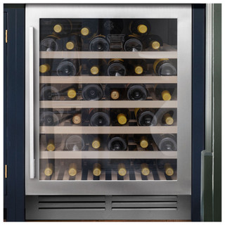 Caple WI6142 60cm Wine Cabinet filled with a variety of wines in a navy blue kitchen