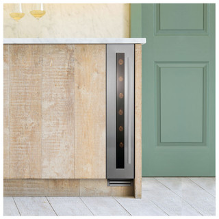 Caple WI159 Wine Cooler in stainless steel seamlessly integrated into a wooden kitchen cabinet.