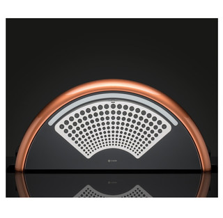 Caple DD925CO Cooker Hood in copper and with patterned grille installed against a black backdrop