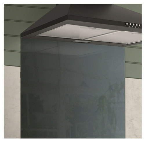 Caple TSB600 Splashback installed below black cooker hood in a kitchen with green walls.