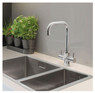 WRAS approved Caple Zuben Kitchen Tap installed over a sink with plant on the countertop