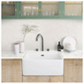 Caple JOY Joya 3 Part Kitchen Tap placed on a white farmhouse sink in a modern kitchen