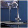 Caple HARPUR Stainless Steel tap with water flowing into a stainless steel sink