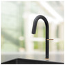 Caple Flutier Kitchen Tap in black, being used over a matching sink in a sunlit kitchen