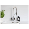 Abode Modern Genio Semi Professional Kitchen Tap on display over white sink in bright kitchen