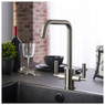 Abode Atlas Quad Monobloc Kitchen Tap in use over sink with wine and dining accessories