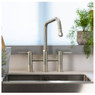 Abode Hex Bridge Pull Out Kitchen Tap with dual handles in use at a bright modern kitchen sink