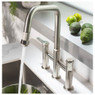 Abode Hex Bridge Pull Out kitchen tap pouring water beside fresh avocados on countertop
