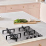 Caple C7061G Gas Hob with four burners in a pink kitchen, set amidst herbs and garlic on a kitchen c