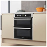 Whirlpool AKL307IX Double Oven lifestyle image at an angle