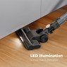 Aeno SC1 cordless vacuum with LED light effectively cleaning under a cabinet