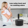 Woman holding her sleeping baby showing the Aeno SV1 Sous Vide kitchen appliance operates quietly an