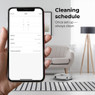 User scheduling cleaning using the Aeno app on a smartphone with the RC4S robot vacuum cleaner in a 