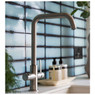 Modern Abode Pronteau Prothia 3 in 1 Monobloc Quad Tap used in a blue tiled kitchen beside hand soap