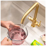 Filling a jug with water from a brass Abode Pronteau Prothia 3 in 1 Monobloc Quad Kitchen Tap