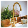 Abode Pronteau ProTrad 3 in 1 Monobloc Kitchen Tap over sink in wooden kitchen with decorative plant