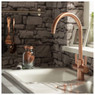 Abode Pronteau Propure 4 in 1 kitchen tap over a white sink against stone tiles