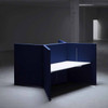 The Hive workstation has been designed to make the most of challenging layouts -  dark blue and white tabletop -  side view - in room.