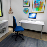 Office chair: Blue task operator chair without arms in the office room, with dished seat, contoured back, waterfall front and gas lift lever for height adjustment. Eclipse Plus II tasks operator chair in black, without arms, adjustable for height and back angle. Office chair: Blue task operator chair without arms in the office room, with dished seat, contoured back, waterfall front and gas lift lever for height adjustment. Eclipse Plus II tasks operator chair in black, without arms, adjustable for height and back angle.