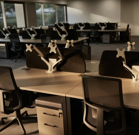 Delta 38 angled acoustic desk screens on bench desks in a modern office logo