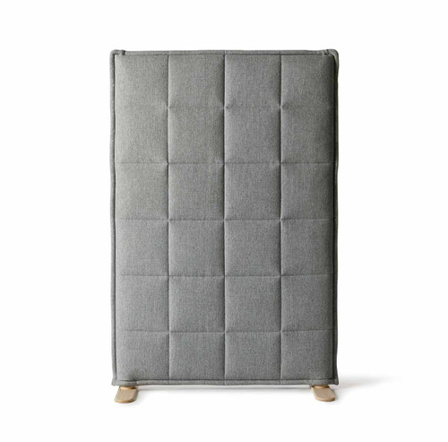 A soft and cosy-looking, sound-absorbent screen upholstered in thick, padded fabric with grid-patterned stitching